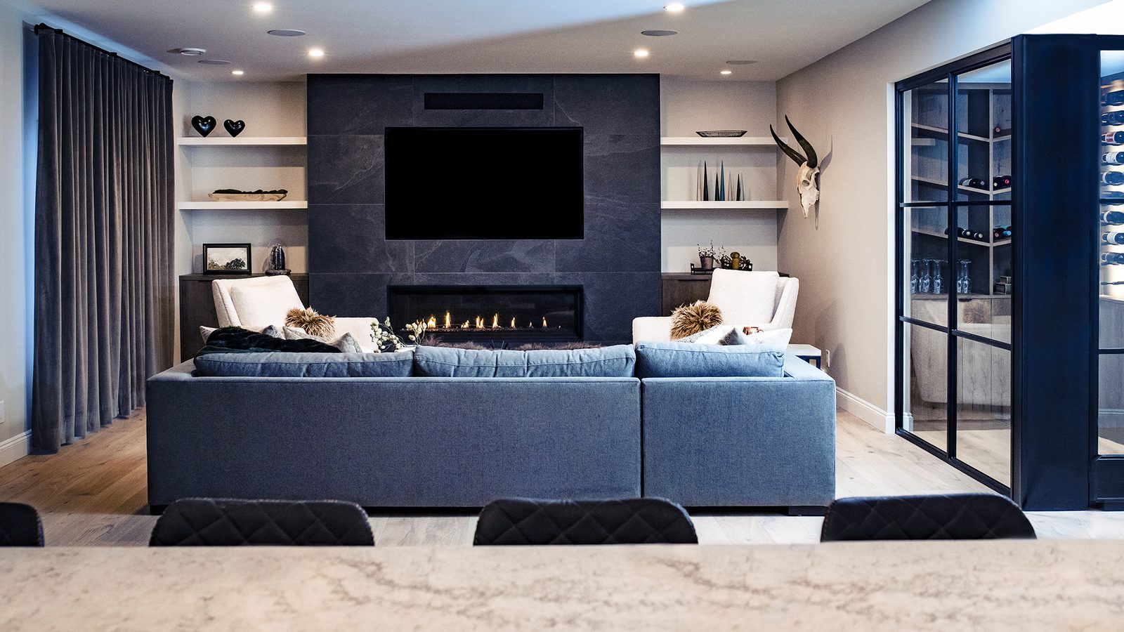 Chestermere living room with stone fireplace